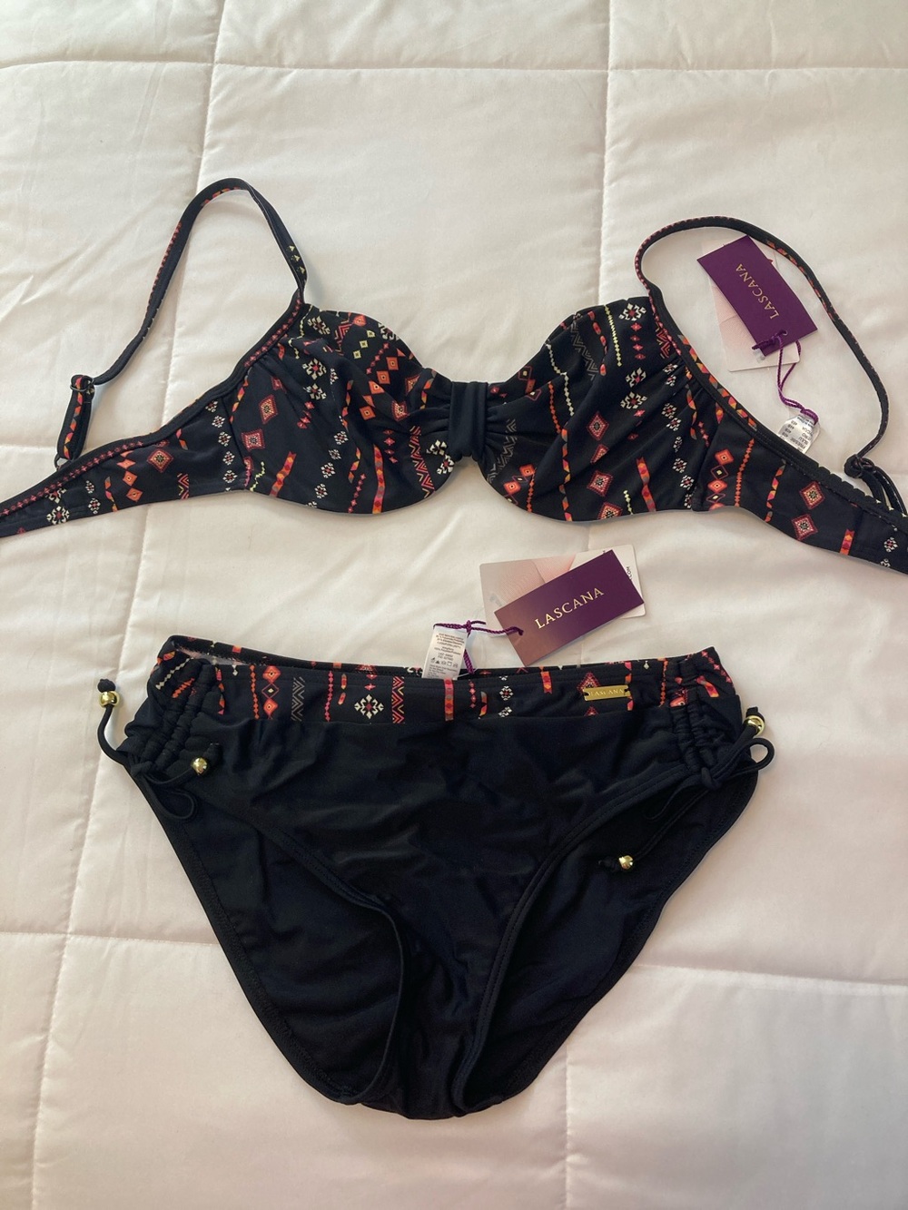 NWT 2 piece bathing suit. Top size 34B. Bottom size 6.